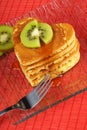 Heart-shaped pancakes with kiwi fruit Royalty Free Stock Photo