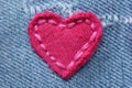 Heart-shaped patch on jeans fabric Royalty Free Stock Photo