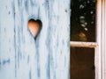 Heart shaped pattern carved in a wooden shutter Royalty Free Stock Photo