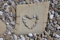 Heart Shaped Pebble on a Rock Royalty Free Stock Photo