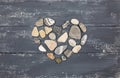 A heart shaped pebble stones on a old wood Royalty Free Stock Photo