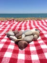 Heart shaped pile of stones at the beach Royalty Free Stock Photo