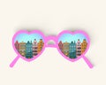 Heart shaped pink mirror glasses with old european buildings.