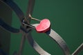 Heart shaped pink padlock on steel bridge rail Royalty Free Stock Photo