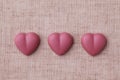 Heart shaped pink ruby chocolate isolated on table cloth Royalty Free Stock Photo