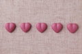 Heart shaped pink ruby chocolate isolated on table cloth Royalty Free Stock Photo