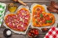 Heart shaped pizza with tomatoes and mozzarella and pepperoni Royalty Free Stock Photo