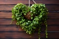 Heart-shaped plant hanger with greenery spilling over, for Valentine\'s. AI Generated Royalty Free Stock Photo