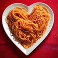 Heart shaped plate of pasta spaghetti, romantic meal for sharing Royalty Free Stock Photo