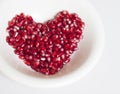 Heart shaped pomegranate seeds Royalty Free Stock Photo