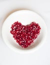 Heart shaped pomegranate seeds Royalty Free Stock Photo