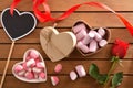 Heart poster and gift with sweets and rose on table