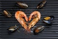 Heart-shaped prawns and mussels, isolated Royalty Free Stock Photo