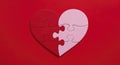 Heart Shaped Puzzle Pieces on Red Background Royalty Free Stock Photo