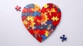 Heart shaped puzzle on white background