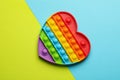 Heart shaped rainbow pop it fidget toy on color background, top view Royalty Free Stock Photo