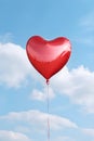 Heart shaped red air balloon flying in blue sky. Symbol of love. St Valentine\'s day concept Royalty Free Stock Photo