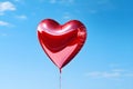 Heart shaped red air balloon flying in blue sky. Symbol of love. St Valentine\'s day concept Royalty Free Stock Photo