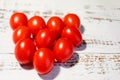 Heart of red cherry tomatoes on a wooden background Royalty Free Stock Photo