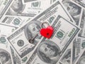 Heart shaped red lock with key and banknotes.Concept of love money forever Royalty Free Stock Photo