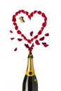 Heart shaped red rose petals champagne bottle Royalty Free Stock Photo