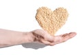 A heart-shaped rice pile, symbolizing love, unity, and hope. The grains, diverse Royalty Free Stock Photo