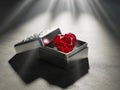 Heart-shaped ruby in an open box Royalty Free Stock Photo