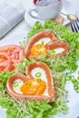 Heart shaped sausages with fried eggs Royalty Free Stock Photo