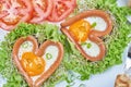 Heart shaped sausages with fried eggs Royalty Free Stock Photo