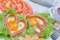 Heart shaped sausages with fried eggs Royalty Free Stock Photo