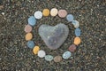 Heart shaped sea stone pebble on sandy beach Royalty Free Stock Photo