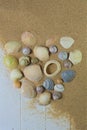 Heart shaped seashells on beach Royalty Free Stock Photo