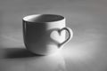 Heart shaped shadow on a coffee cup, black and white Royalty Free Stock Photo