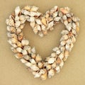 Heart Shaped Shell Wreath on Beach Sand Royalty Free Stock Photo