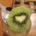 A heart-shaped slice of fresh Kiwi fruit