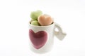Heart shaped soaps in cup Royalty Free Stock Photo