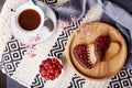 Heart shaped St Valentines cookies with raspberry taste with cup of coffee. Romantic holiday food background. Top view