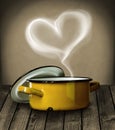 Heart shaped steam above a yellow pot Royalty Free Stock Photo