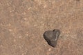 A heart-shaped stone with space for texts, copy space Royalty Free Stock Photo