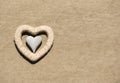 Heart shaped stone on yellow sand, beach background Royalty Free Stock Photo