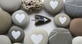 Heart Shaped Stones and Arrow on White Royalty Free Stock Photo