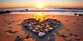 Heart-shaped stones on a sandy beach, illuminated by the warm colors of a sunset Royalty Free Stock Photo