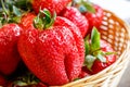 Heart-shaped strawberry in the basket.