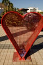 Heart-shaped structure to deposit plastic caps.