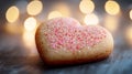 Heart-Shaped Sugar Cookie with Pink Sprinkles on Dark Background Royalty Free Stock Photo