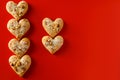 Heart shaped sugar cookies on red background Royalty Free Stock Photo