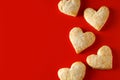 Heart shaped sugar cookies on red background Royalty Free Stock Photo