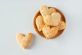 Heart shaped sugar cookies on a wooden plate Royalty Free Stock Photo