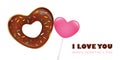 Heart shaped sweet donut with sprinkles and lollipop