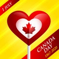 Heart shaped sweet lollipop and maple leaf, Canada symbol on a yellow background Royalty Free Stock Photo